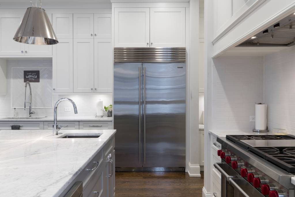 A clean stainless-steel refrigerator in a kitchen